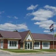 Alburgh municipal building and lawn with blue sky